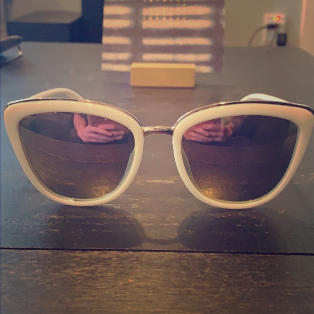 White and silver framed sunglasses